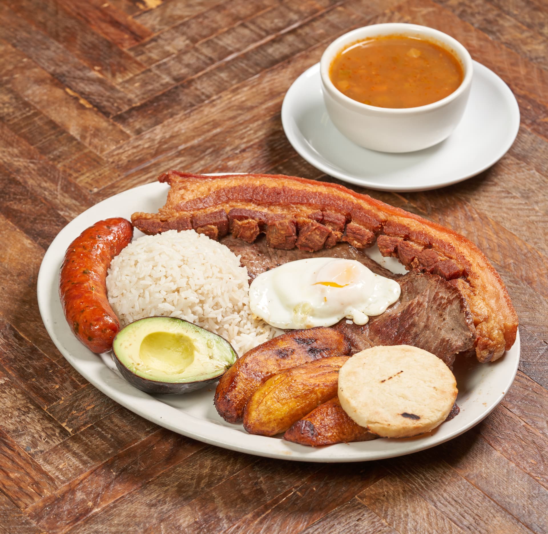 Traditional bandeja paisa on a rustic plate